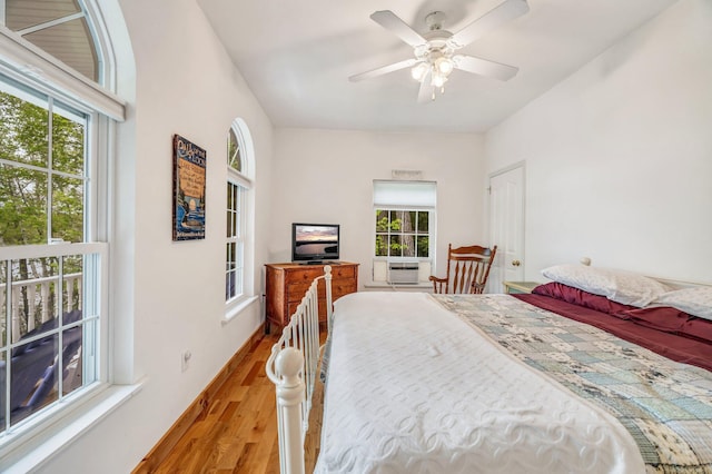 700 Pond Rd, Saint Albans, ME 04971 - bedroom featuring wood finished floors, multiple windows, and cooling unit