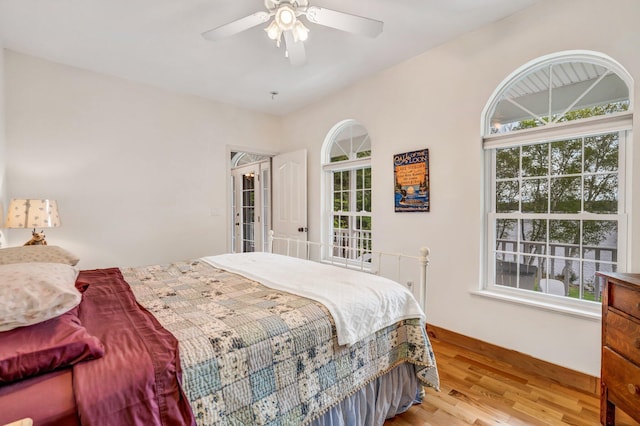 700 Pond Rd, Saint Albans, ME 04971 - bedroom with multiple windows, wood finished floors, baseboards, and ceiling fan