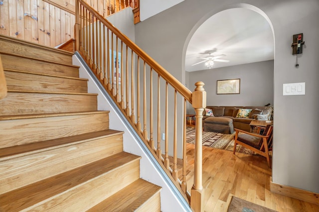 700 Pond Rd, Saint Albans, ME 04971 - stairs with arched walkways, a ceiling fan, and wood finished floors