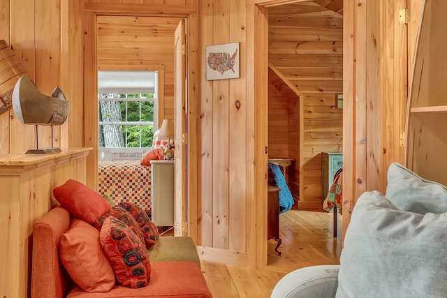 700 Pond Rd, Saint Albans, ME 04971 - bedroom with wood walls and light wood-type flooring