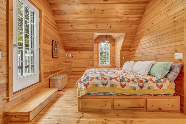 700 Pond Rd, Saint Albans, ME 04971 - bedroom featuring wood walls, light wood-style floors, and lofted ceiling