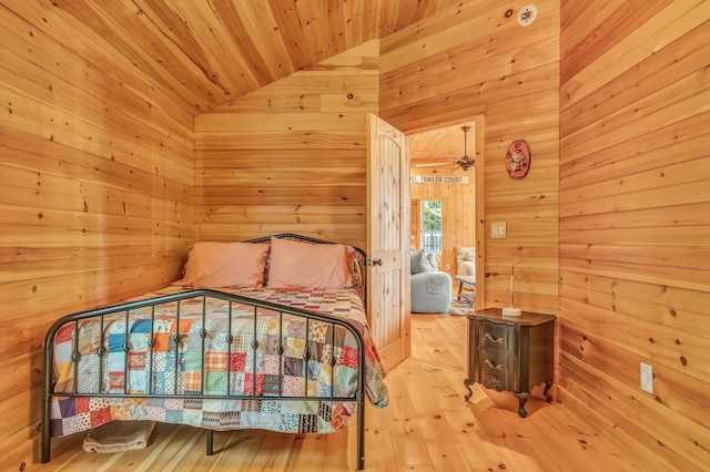 700 Pond Rd, Saint Albans, ME 04971 - bedroom with wood walls, wood ceiling, wood-type flooring, and vaulted ceiling