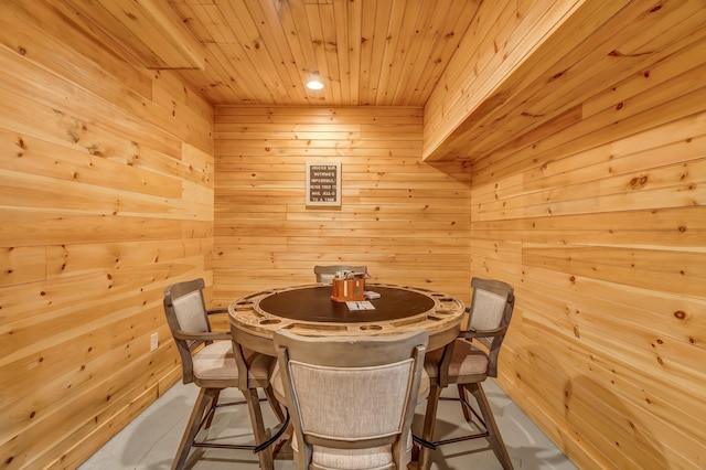 700 Pond Rd, Saint Albans, ME 04971 - dining room with wooden walls, wood ceiling, and concrete floors