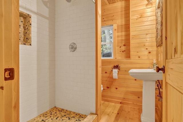 700 Pond Rd, Saint Albans, ME 04971 - full bath featuring a shower stall, wooden walls, toilet, and a sink
