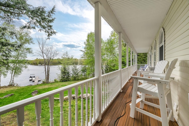 700 Pond Rd, Saint Albans, ME 04971 - wooden porch with a water view