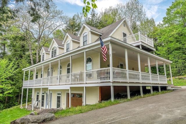 700 Pond Rd, Saint Albans, ME 04971 - farmhouse-style home with a porch and a balcony