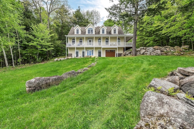 700 Pond Rd, Saint Albans, ME 04971 - view of front of property featuring a balcony, an attached garage, a front yard, and covered porch