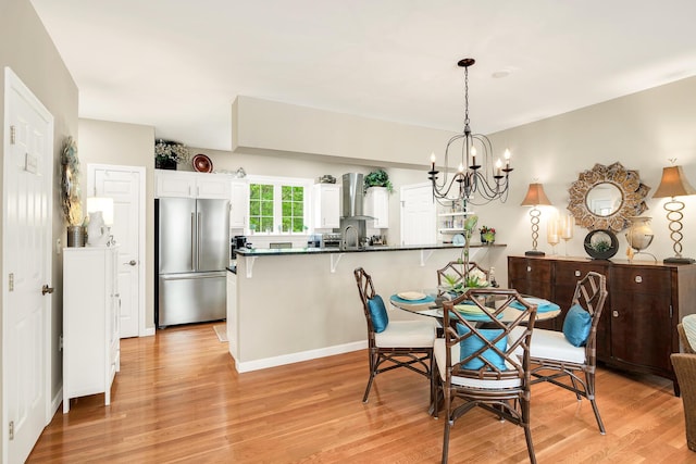 19 Winding Brook Ln S Unit 19, Wells, ME 04090 - dining room featuring light wood-style flooring and a chandelier
