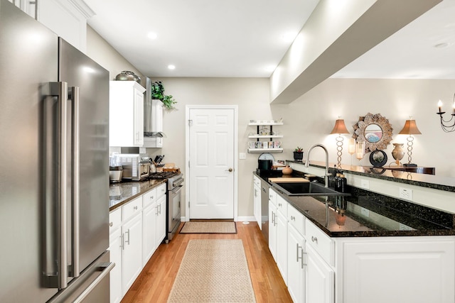 19 Winding Brook Ln S Unit 19, Wells, ME 04090 - kitchen with appliances with stainless steel finishes, a sink, light wood-style floors, white cabinets, and recessed lighting