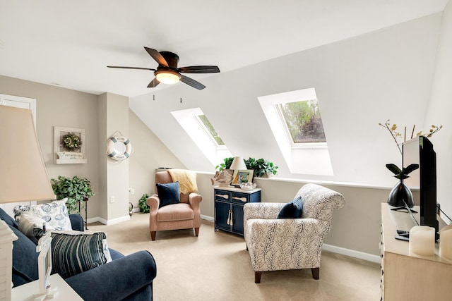 19 Winding Brook Ln S Unit 19, Wells, ME 04090 - living area with a skylight, light carpet, ceiling fan, baseboards, and lofted ceiling