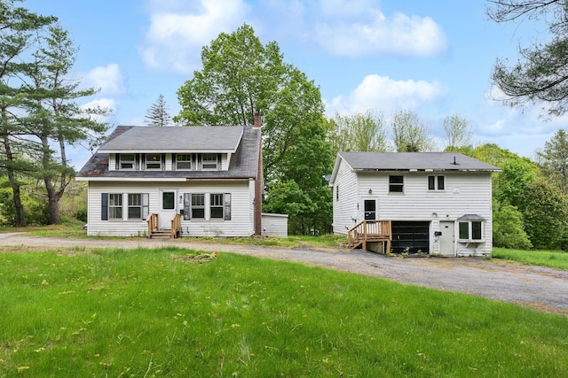 705707 Maine Ave, Farmingdale, ME 04344 - back of house with a chimney and entry steps