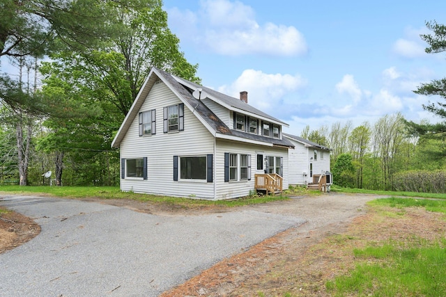 705707 Maine Ave, Farmingdale, ME 04344 - view of front facade with a chimney