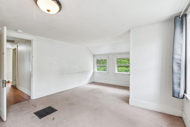 705707 Maine Ave, Farmingdale, ME 04344 - carpeted spare room featuring vaulted ceiling and baseboards