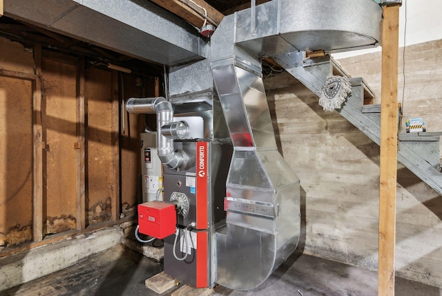 705707 Maine Ave, Farmingdale, ME 04344 - utility room featuring electric water heater and heating unit