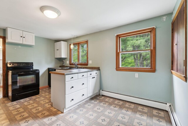 705707 Maine Ave, Farmingdale, ME 04344 - kitchen featuring black appliances, a sink, white cabinets, a peninsula, and a baseboard heating unit