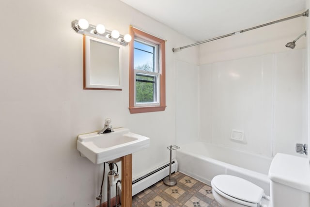 705707 Maine Ave, Farmingdale, ME 04344 - bathroom featuring a baseboard heating unit, toilet, and shower / washtub combination