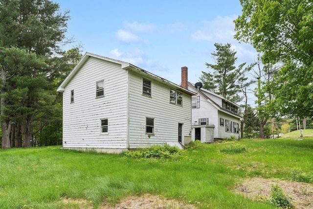 705707 Maine Ave, Farmingdale, ME 04344 - view of property exterior with a chimney