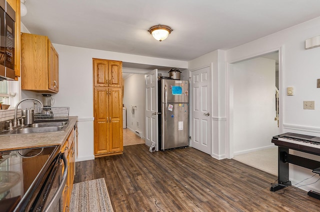 107 Tidy Rd Unit A & B, Eliot, ME 03903 - kitchen featuring freestanding refrigerator, a sink, range with electric stovetop, dark wood-style flooring, and brown cabinets