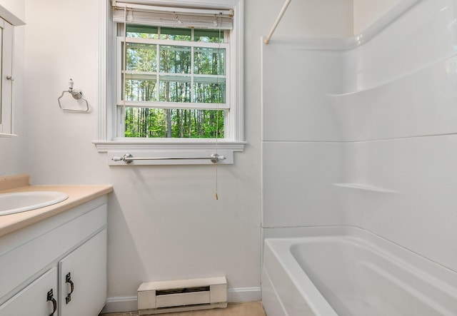 107 Tidy Rd Unit A & B, Eliot, ME 03903 - bathroom with vanity, a baseboard heating unit, baseboards, and shower / bath combination