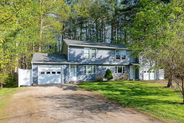 107 Tidy Rd Unit A & B, Eliot, ME 03903 - colonial inspired home with driveway, an attached garage, and a front lawn
