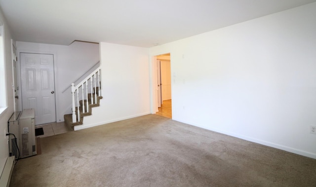 107 Tidy Rd Unit A & B, Eliot, ME 03903 - carpeted empty room featuring stairway, a baseboard heating unit, and baseboards