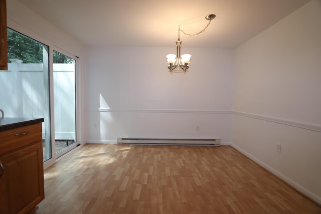 107 Tidy Rd Unit A & B, Eliot, ME 03903 - unfurnished dining area with a chandelier, light wood-type flooring, a baseboard radiator, and baseboards