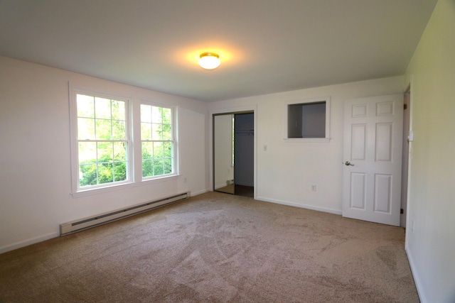 107 Tidy Rd Unit A & B, Eliot, ME 03903 - unfurnished bedroom featuring baseboard heating, carpet flooring, a closet, and baseboards