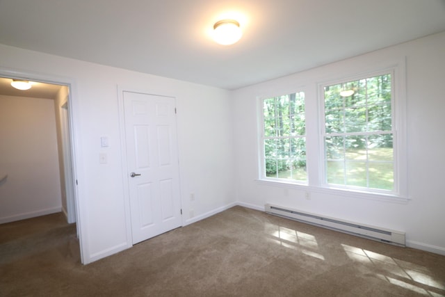 107 Tidy Rd Unit A & B, Eliot, ME 03903 - unfurnished bedroom featuring a baseboard heating unit, carpet flooring, and baseboards