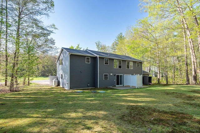 107 Tidy Rd Unit A & B, Eliot, ME 03903 - rear view of house featuring a yard and a patio