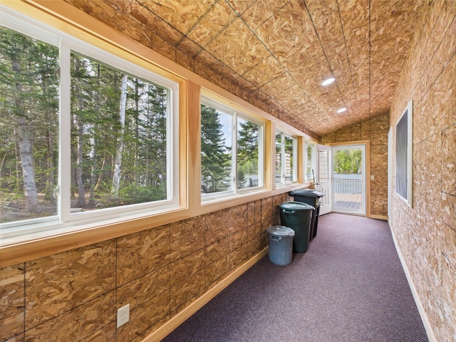 1107 S Shore Rd, Madawaska Lake Twp, ME 04783 - unfurnished sunroom featuring carpet and vaulted ceiling