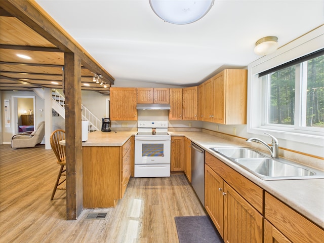 1107 S Shore Rd, Madawaska Lake Twp, ME 04783 - kitchen featuring white range with electric cooktop, stainless steel dishwasher, a sink, light wood-style flooring, and vaulted ceiling