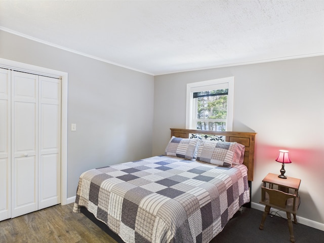 1107 S Shore Rd, Madawaska Lake Twp, ME 04783 - bedroom with wood finished floors, baseboards, ornamental molding, and a closet