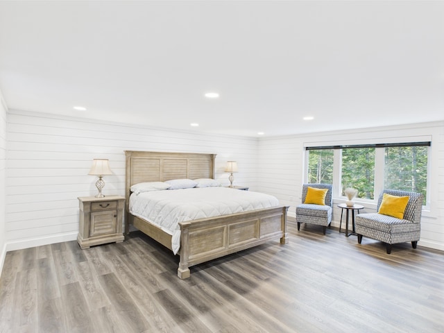 1107 S Shore Rd, Madawaska Lake Twp, ME 04783 - bedroom featuring wood finished floors, recessed lighting, and wooden walls