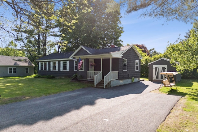 83 E Cote St, Lewiston, ME 04240 - view of front of home with a front lawn and a porch