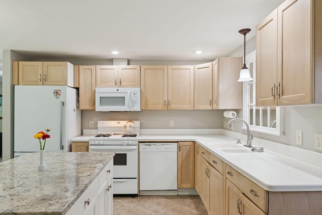 83 E Cote St, Lewiston, ME 04240 - kitchen featuring white appliances, light brown cabinets, a sink, hanging light fixtures, and recessed lighting