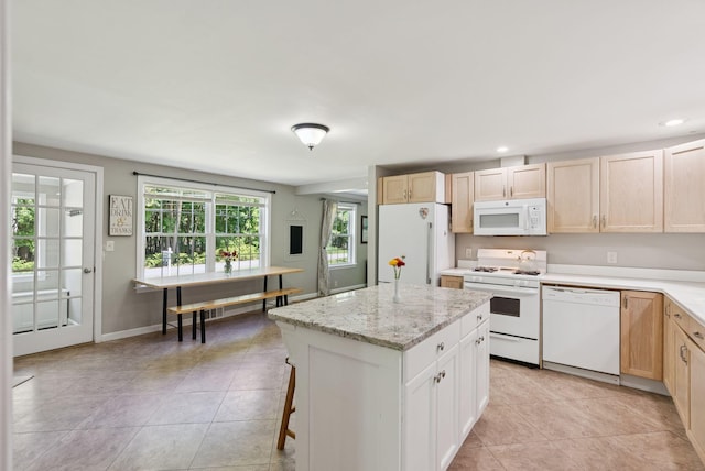 83 E Cote St, Lewiston, ME 04240 - kitchen with white appliances, recessed lighting, a center island, light brown cabinetry, and light tile patterned flooring