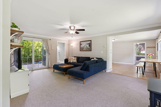 83 E Cote St, Lewiston, ME 04240 - carpeted living area featuring crown molding, ceiling fan, and baseboards