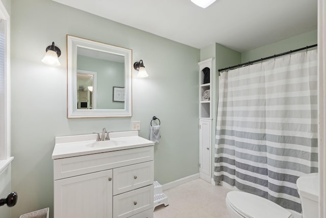 83 E Cote St, Lewiston, ME 04240 - bathroom with toilet, vanity, and curtained shower