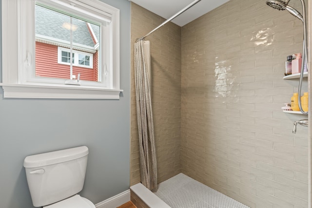 15 Pacer Way, Scarborough, ME 04074 - bathroom featuring toilet, tiled shower, and baseboards