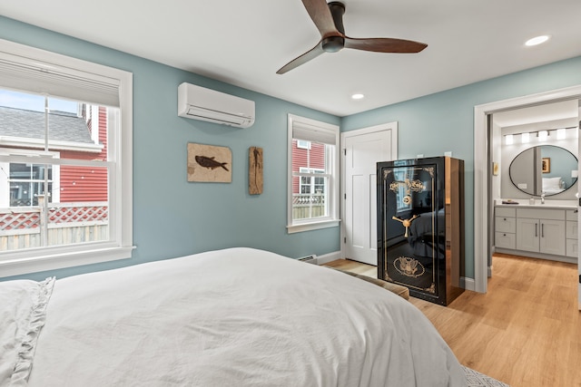 15 Pacer Way, Scarborough, ME 04074 - bedroom featuring a wall mounted air conditioner, multiple windows, light wood-style flooring, baseboards, and recessed lighting