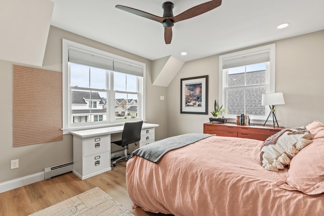 15 Pacer Way, Scarborough, ME 04074 - bedroom with light wood-style flooring, a baseboard radiator, an office area, multiple windows, and recessed lighting