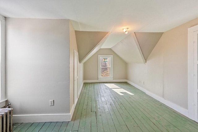 2 Elm Ter, Waterville, ME 04901 - bonus room featuring radiator heating unit, baseboards, hardwood / wood-style floors, and lofted ceiling