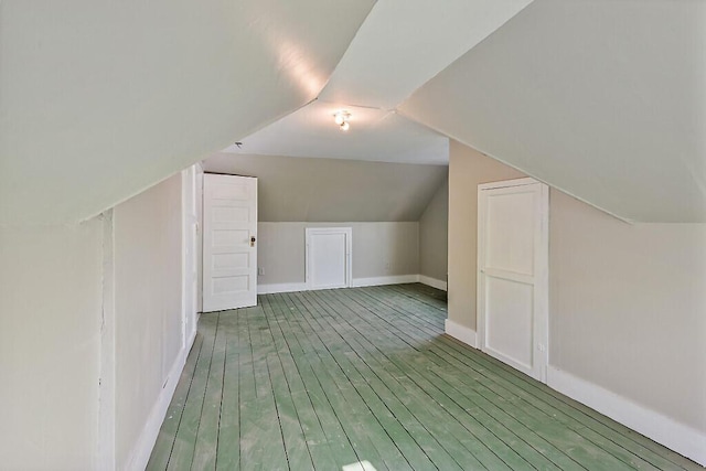 2 Elm Ter, Waterville, ME 04901 - additional living space with lofted ceiling, baseboards, and wood finished floors
