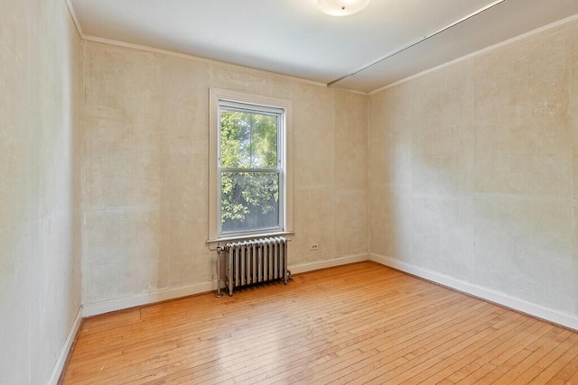 2 Elm Ter, Waterville, ME 04901 - empty room featuring radiator heating unit, wood-type flooring, crown molding, and baseboards