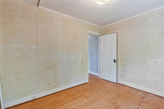 2 Elm Ter, Waterville, ME 04901 - empty room featuring wood-type flooring, ornamental molding, and baseboards
