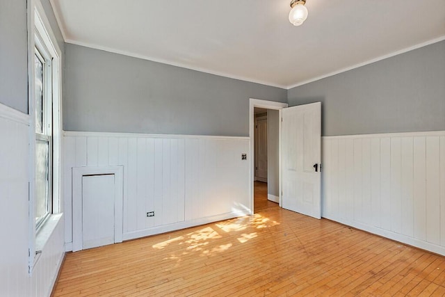 2 Elm Ter, Waterville, ME 04901 - unfurnished room featuring wainscoting, wood-type flooring, and ornamental molding