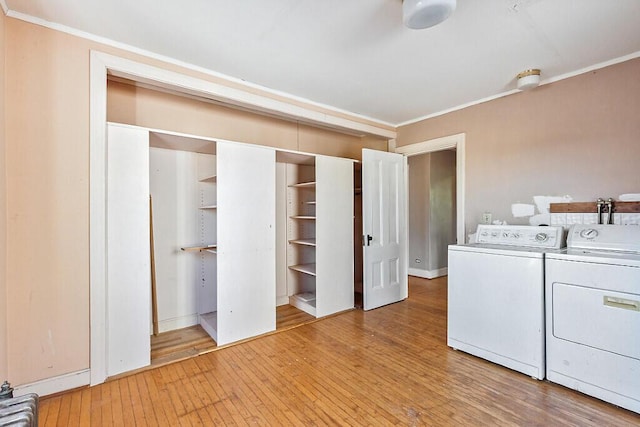 2 Elm Ter, Waterville, ME 04901 - laundry area with washing machine and clothes dryer, ornamental molding, light wood-style floors, and baseboards