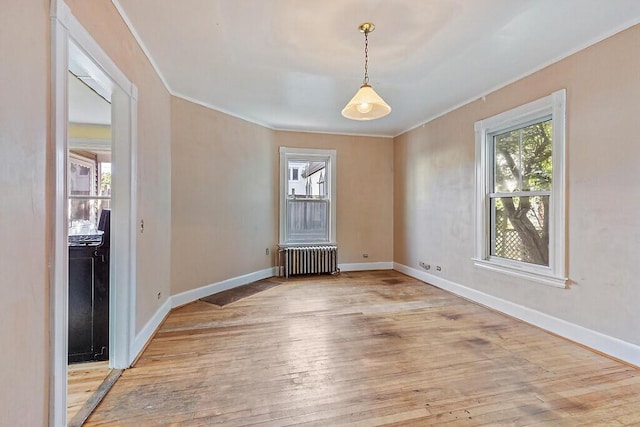 2 Elm Ter, Waterville, ME 04901 - unfurnished room with radiator, crown molding, light wood-type flooring, and baseboards
