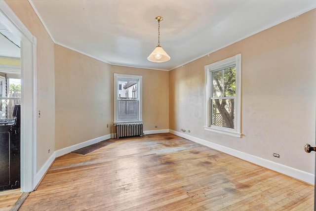 2 Elm Ter, Waterville, ME 04901 - spare room with radiator heating unit, ornamental molding, hardwood / wood-style floors, and baseboards