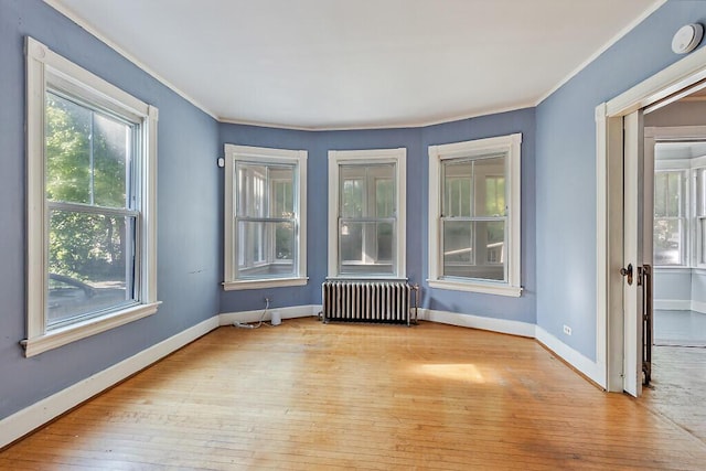 2 Elm Ter, Waterville, ME 04901 - unfurnished room with radiator, hardwood / wood-style flooring, ornamental molding, and baseboards